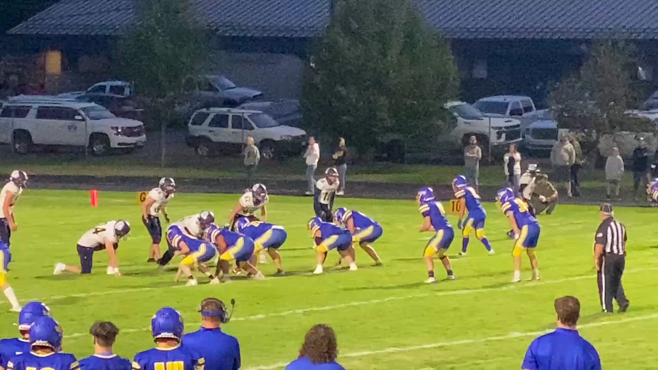 Center Grant Opitz pancakes DT on strong run by HB Isaac Nelson vs Kettle Falls.